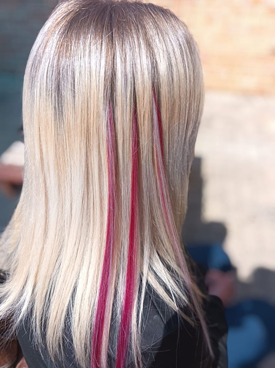 Blonde hair with vivid pink streaks