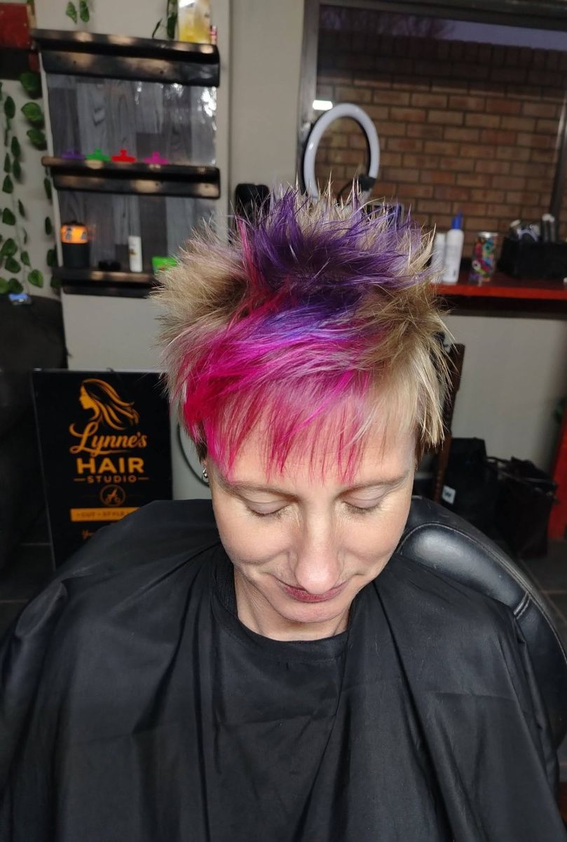 Short pixie cut with pink and purple creative colour