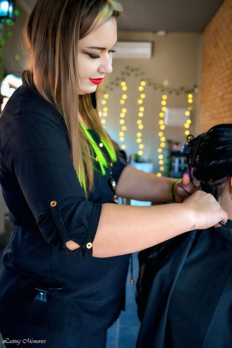 Lynne styling a client’s hair inside the studio